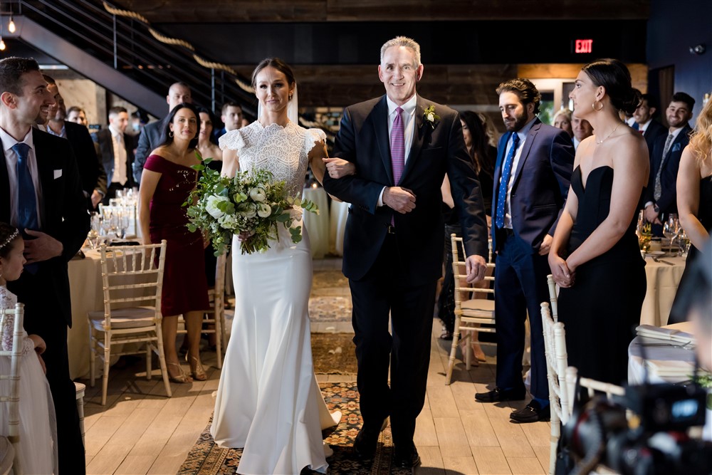 bride and dad walking down the aisle