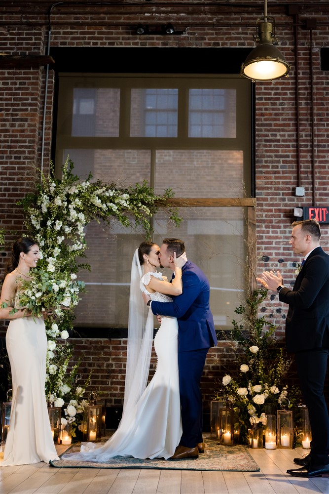 bride and groom's first kiss