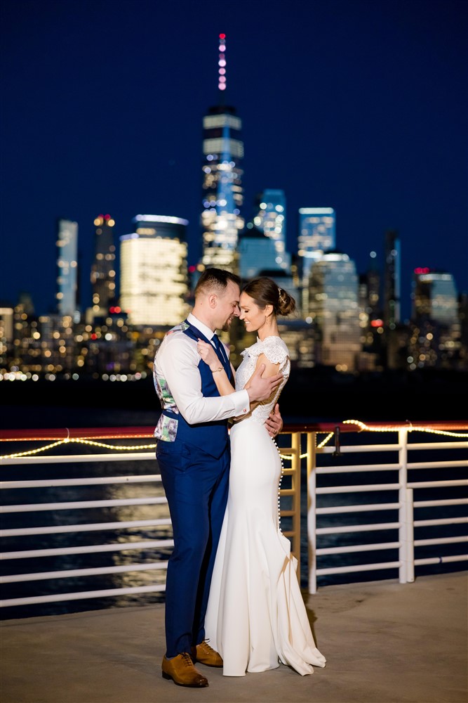 bride and groom shot on nyc jersey city skyline view