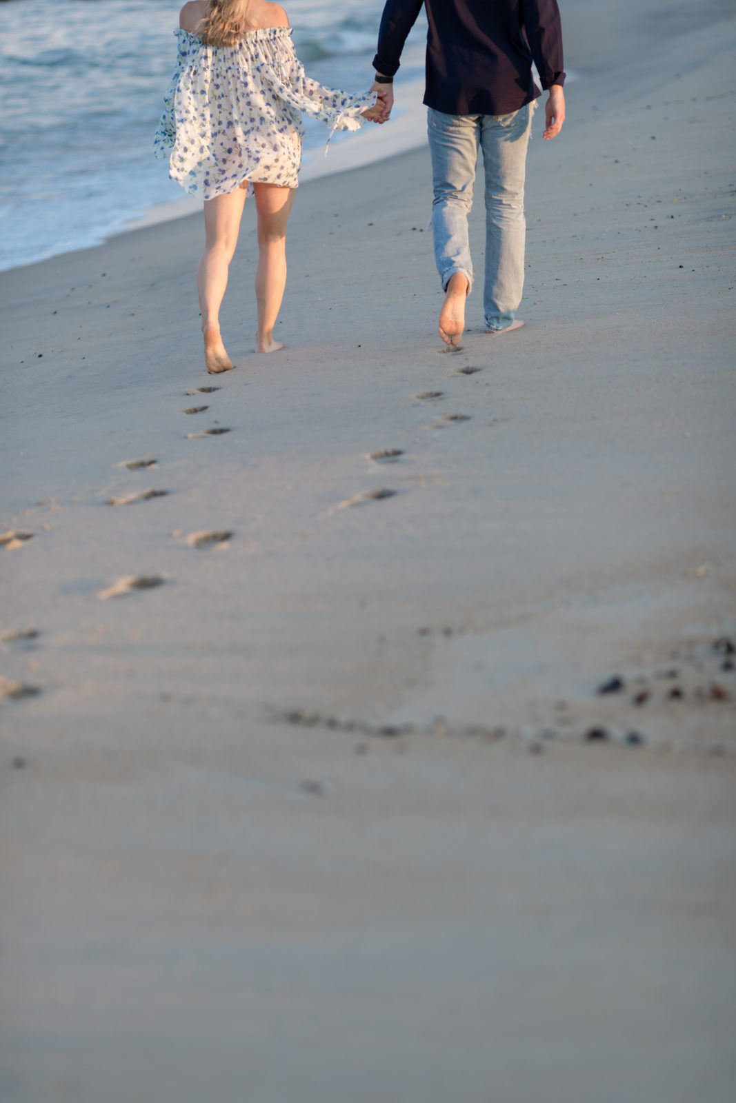 WALKING ON SPRING LAKE BEACH ENGAGEMENT PHOTOS