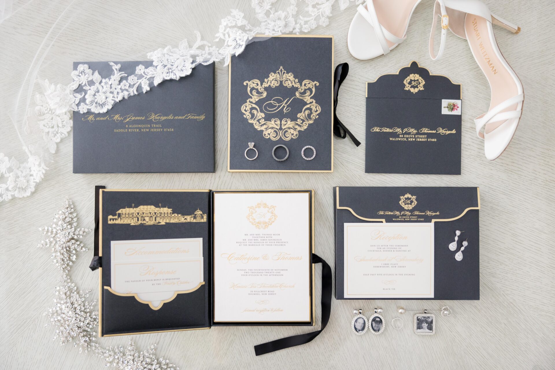 Black and gold invitation suite with lace veil edge, white heels and earrings